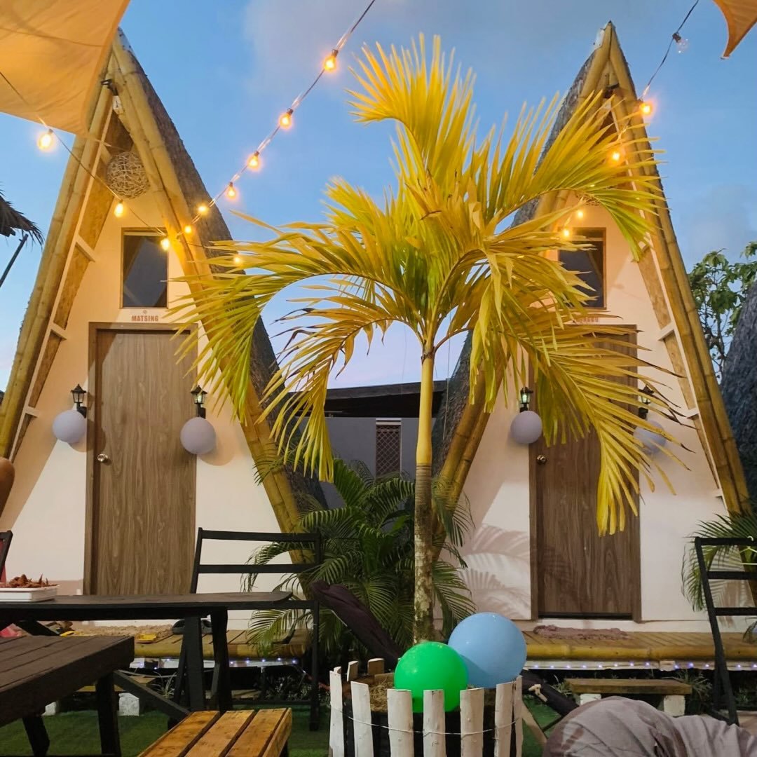 Happy Monkey A-frame cabins at dusk