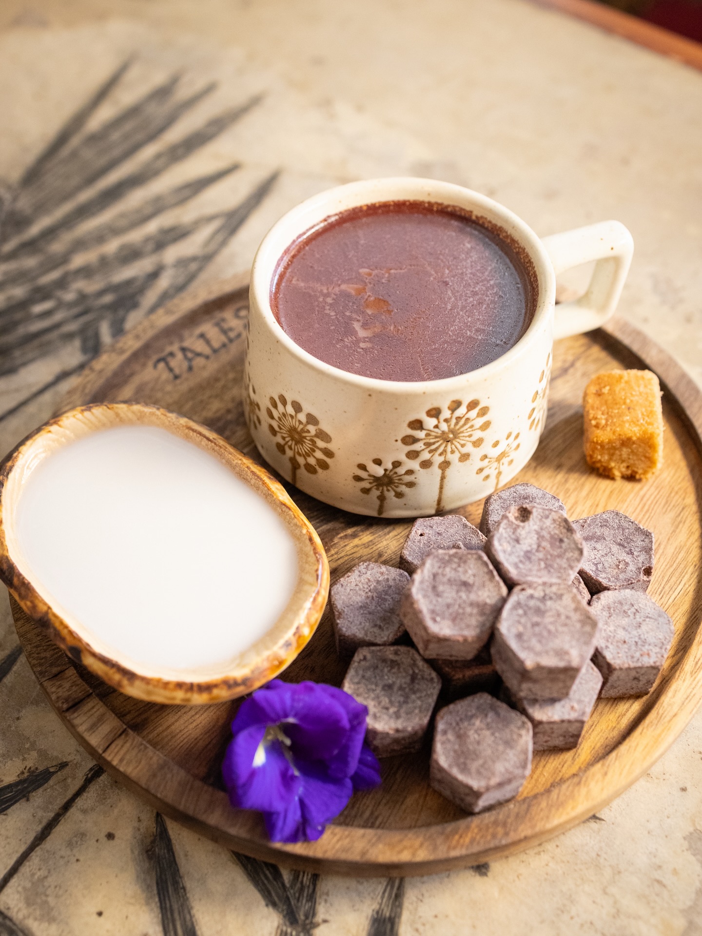 Tabelya cacao drink with coconut milk on a Tales of the Islands branded board
